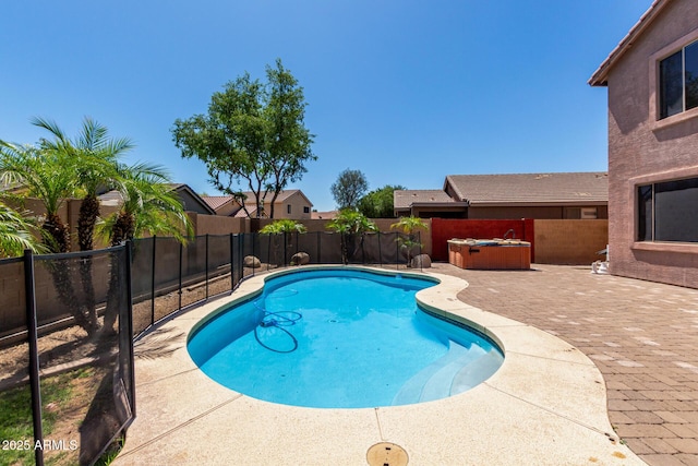 view of swimming pool featuring a fenced backyard, a fenced in pool, a patio, and a hot tub