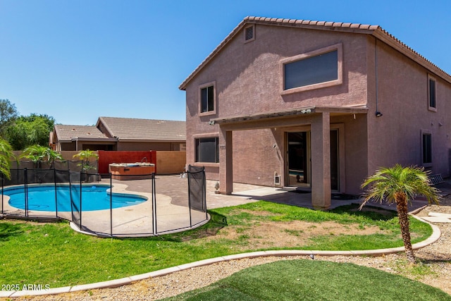 view of swimming pool with a yard, a patio, a fenced in pool, and a fenced backyard