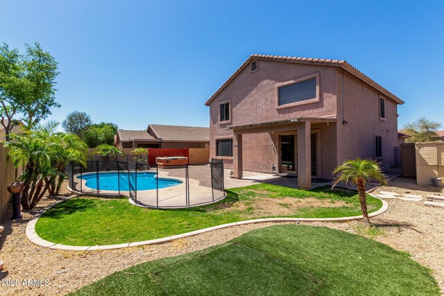 16527 N 71st Dr, Peoria, AZ 85382 - back of property with a yard, a patio, a fenced backyard, and stucco siding