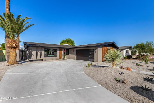 ranch-style home with a garage