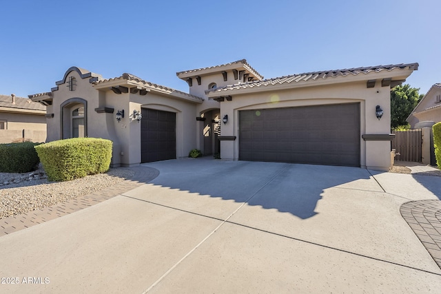 mediterranean / spanish-style home featuring a garage