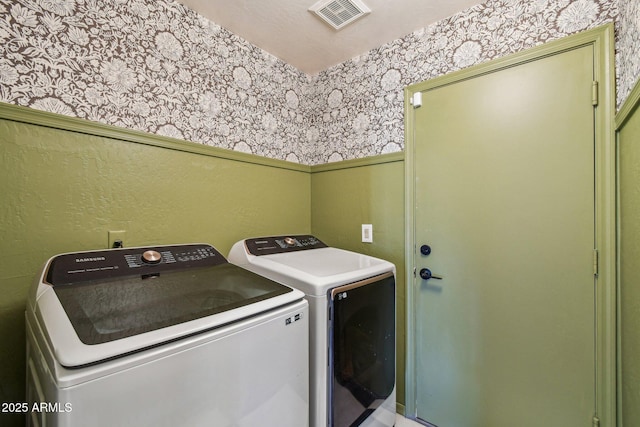 laundry room with separate washer and dryer