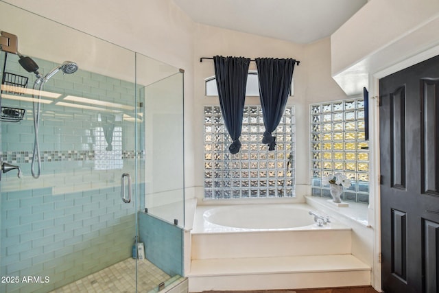 full bath featuring a garden tub and a shower stall