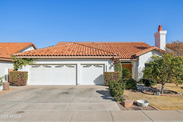 mediterranean / spanish-style home featuring concrete driveway, a chimney, a tiled roof, an attached garage, and stucco siding