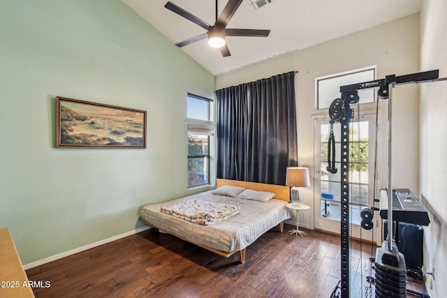 bedroom featuring high vaulted ceiling, visible vents, baseboards, and wood finished floors