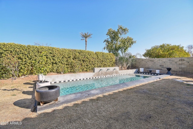 view of swimming pool with a fenced in pool and a fenced backyard