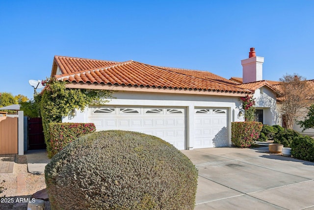 mediterranean / spanish-style home featuring a garage, driveway, a tile roof, and stucco siding