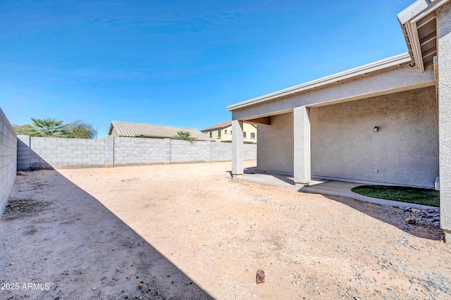 view of yard featuring a fenced backyard and a patio