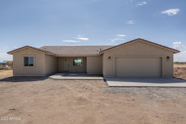 single story home with a garage