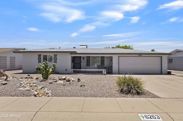 6263 E Duncan St, Mesa, AZ 85205 - ranch-style house featuring a porch, a garage, and concrete driveway