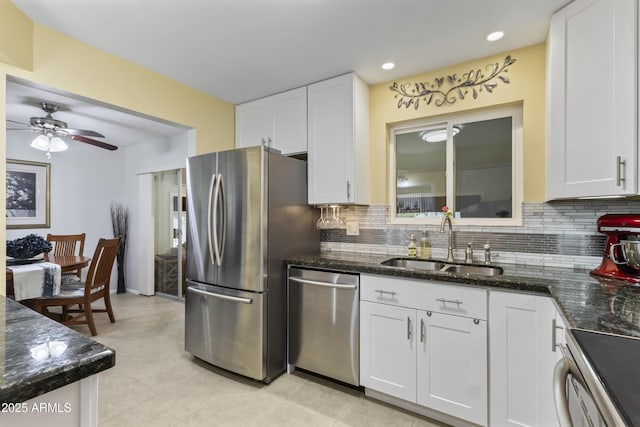 6263 E Duncan St, Mesa, AZ 85205 - kitchen with stainless steel appliances, tasteful backsplash, white cabinets, ceiling fan, and recessed lighting