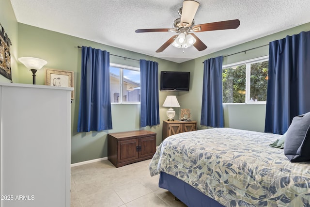 6263 E Duncan St, Mesa, AZ 85205 - bedroom featuring a textured ceiling, tile patterned flooring, and a ceiling fan