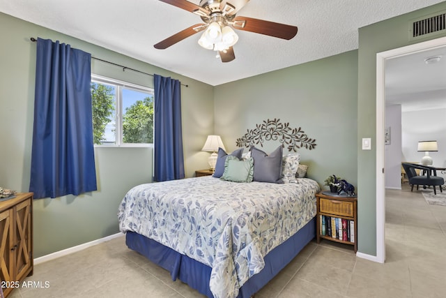6263 E Duncan St, Mesa, AZ 85205 - tiled bedroom featuring baseboards and a ceiling fan