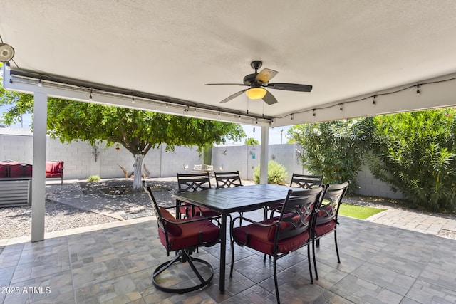 6263 E Duncan St, Mesa, AZ 85205 - fenced backyard with a patio area, ceiling fan, and outdoor dining space