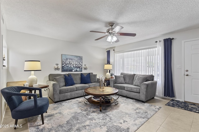 6263 E Duncan St, Mesa, AZ 85205 - living room with ceiling fan, a textured ceiling, and light tile patterned floors