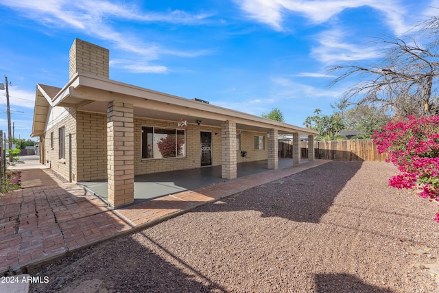 back of property featuring a patio