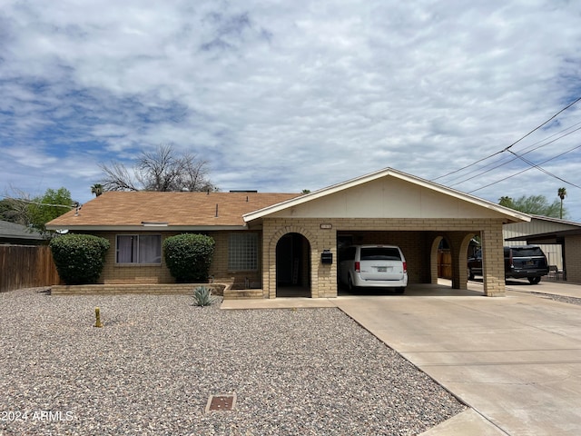 ranch-style home with a carport