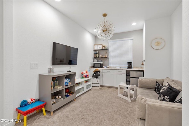 living room featuring light carpet, a chandelier, and recessed lighting