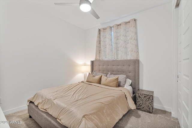 bedroom featuring ceiling fan, baseboards, and carpet