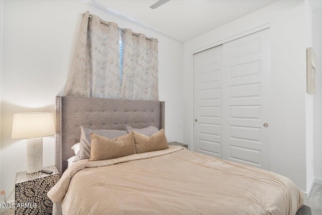 bedroom with baseboards and a closet