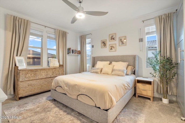 bedroom with light carpet and ceiling fan
