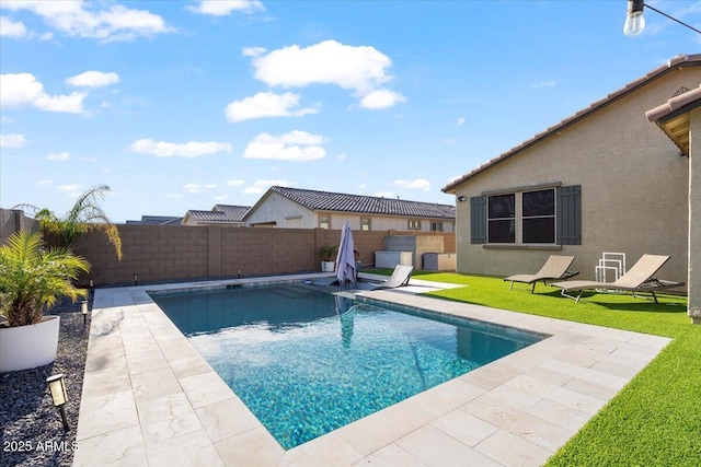view of swimming pool with a fenced backyard, a patio area, and a fenced in pool