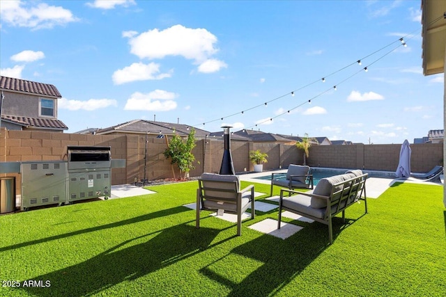 view of yard with an outdoor living space, a fenced backyard, and a fenced in pool