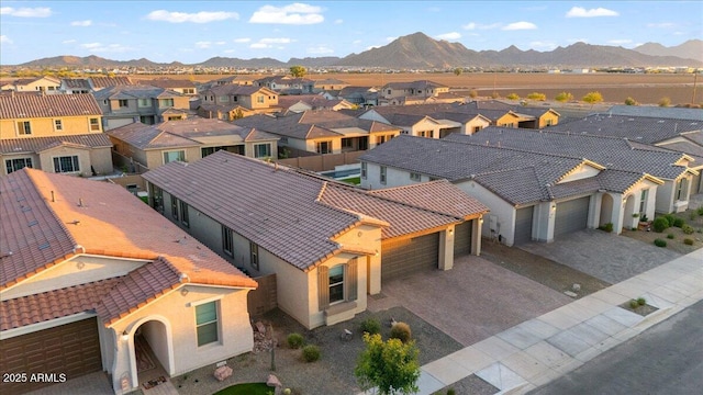birds eye view of property with a residential view and a mountain view