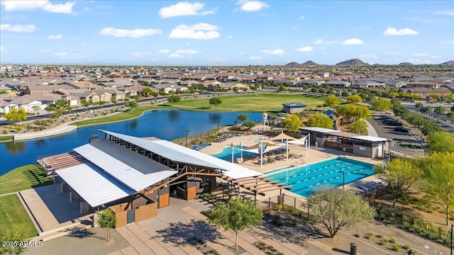 birds eye view of property featuring a water and mountain view and a residential view