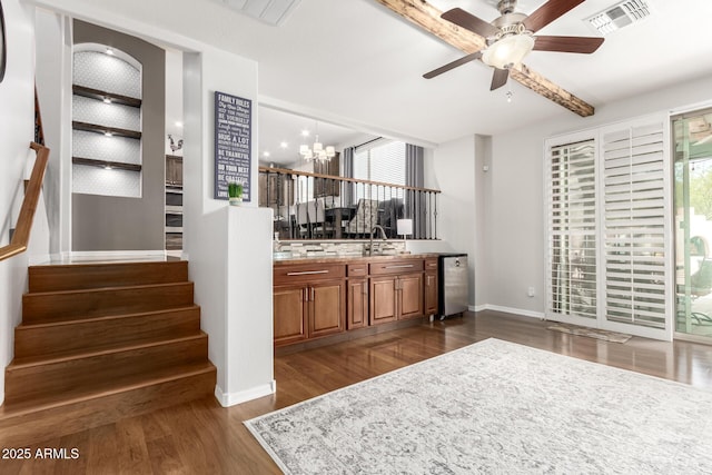 42711 N 45th Dr, Phoenix, AZ 85087 - bar featuring plenty of natural light, ceiling fan with notable chandelier, visible vents, and stairway