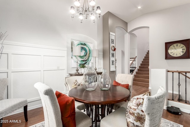 42711 N 45th Dr, Phoenix, AZ 85087 - dining space featuring arched walkways, a chandelier, stairs, recessed lighting, and wood finished floors