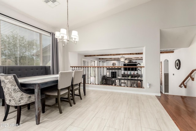 42711 N 45th Dr, Phoenix, AZ 85087 - dining area featuring arched walkways, ceiling fan with notable chandelier, and visible vents