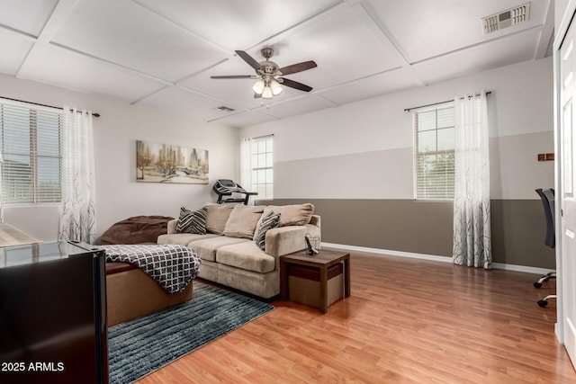 42711 N 45th Dr, Phoenix, AZ 85087 - living area featuring a ceiling fan, baseboards, light wood-type flooring, visible vents, and coffered ceiling