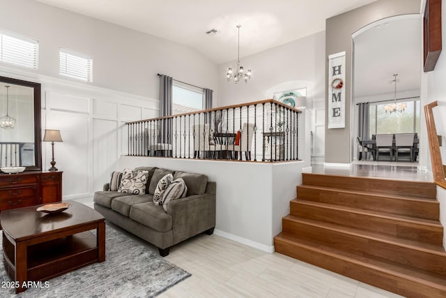 42711 N 45th Dr, Phoenix, AZ 85087 - living area with visible vents, a chandelier, stairway, and a decorative wall