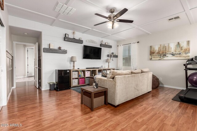 42711 N 45th Dr, Phoenix, AZ 85087 - living room featuring ceiling fan, coffered ceiling, light wood finished floors, and visible vents