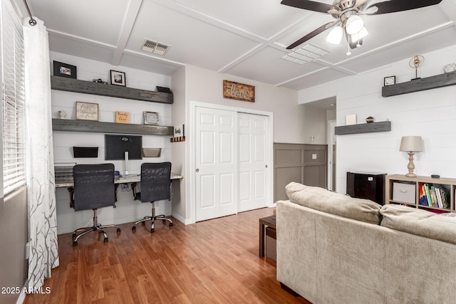 42711 N 45th Dr, Phoenix, AZ 85087 - living room with built in study area, ceiling fan, wood finished floors, and visible vents