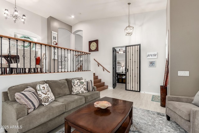 42711 N 45th Dr, Phoenix, AZ 85087 - living area featuring light wood-style floors, baseboards, stairway, recessed lighting, and a notable chandelier