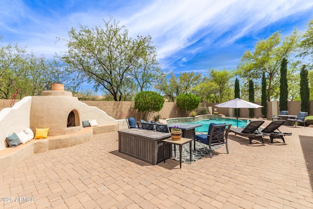 42711 N 45th Dr, Phoenix, AZ 85087 - view of patio featuring an outdoor stone fireplace, a fenced backyard, and a fenced in pool