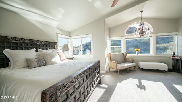 bedroom featuring lofted ceiling, multiple windows, and light colored carpet