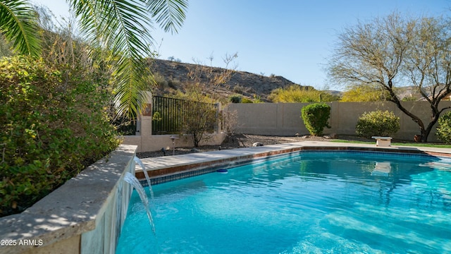 view of swimming pool featuring a fenced backyard