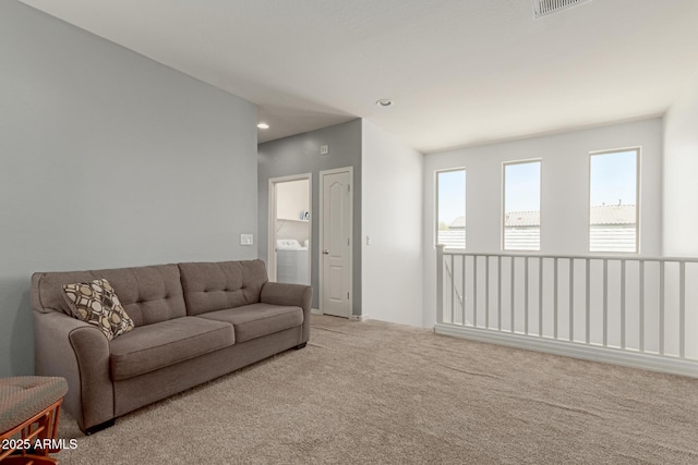 19771 W Woodlands Ave, Buckeye, AZ 85326 - living room with carpet flooring, washer / clothes dryer, and recessed lighting