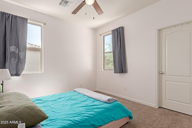 19771 W Woodlands Ave, Buckeye, AZ 85326 - carpeted bedroom featuring baseboards and a ceiling fan