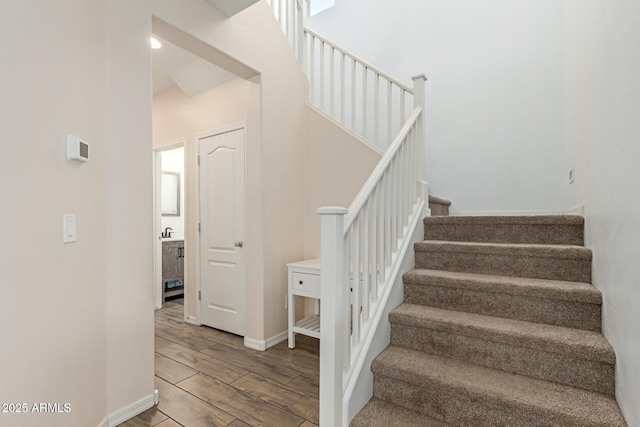 19771 W Woodlands Ave, Buckeye, AZ 85326 - stairs with wood finished floors and baseboards