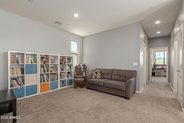 19771 W Woodlands Ave, Buckeye, AZ 85326 - carpeted living room featuring recessed lighting and baseboards