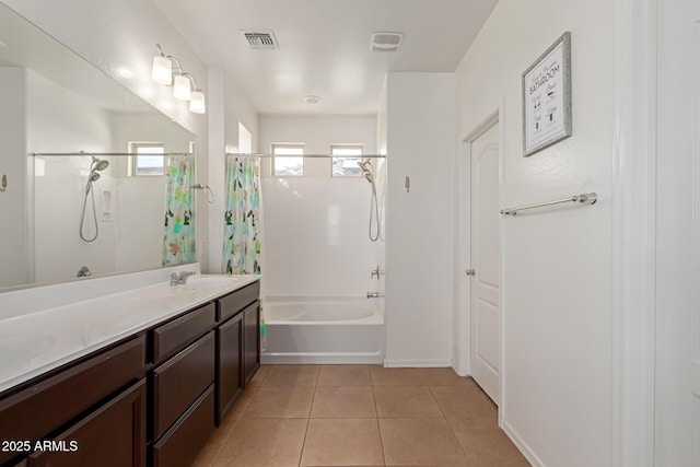 19771 W Woodlands Ave, Buckeye, AZ 85326 - full bathroom with shower / bath combo, double vanity, and tile patterned flooring