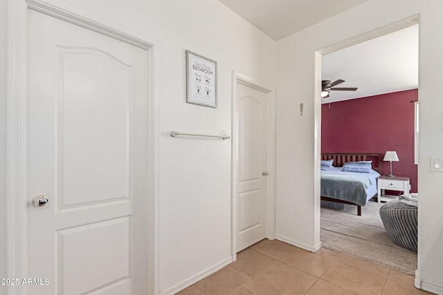 19771 W Woodlands Ave, Buckeye, AZ 85326 - corridor featuring light tile patterned flooring and light colored carpet