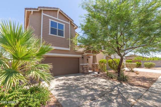 19771 W Woodlands Ave, Buckeye, AZ 85326 - view of front of house with a garage, concrete driveway, stone siding, and stucco siding