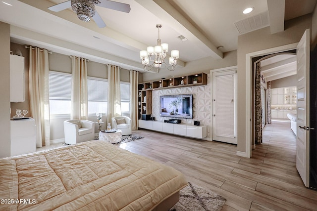 bedroom with beamed ceiling, visible vents, an inviting chandelier, and light wood-style floors