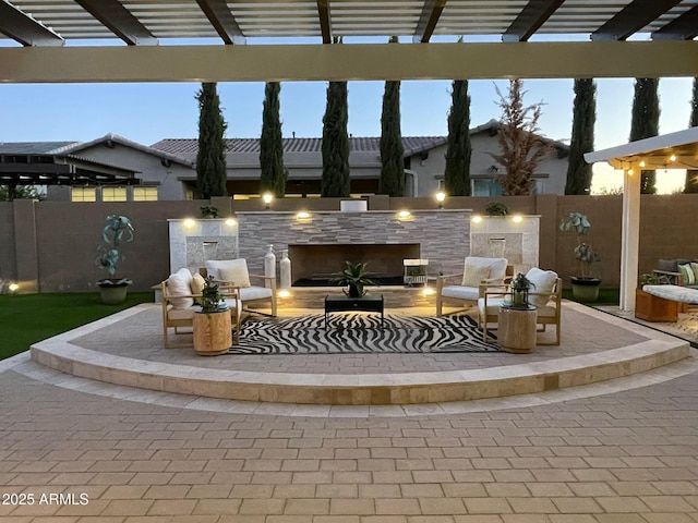 view of patio / terrace with a pergola, an outdoor living space, and a fenced backyard