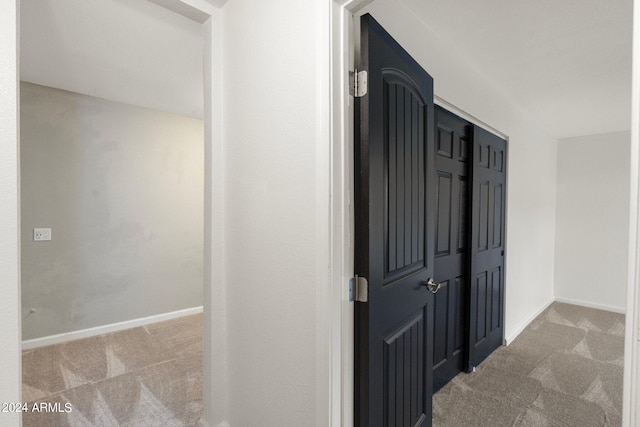 hallway with carpet flooring